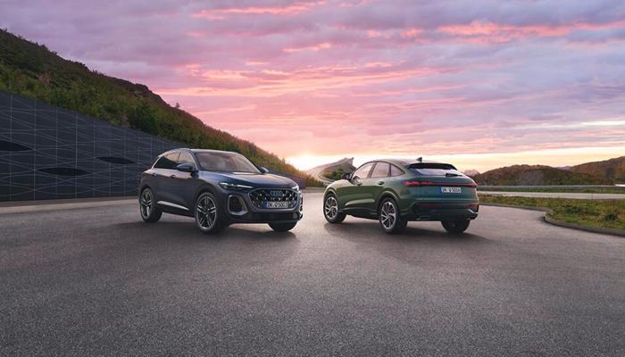 Der neue Audi Q5 SUV und der neue Audi Q5 Sportback vor einem malerischen Sonnenuntergang.